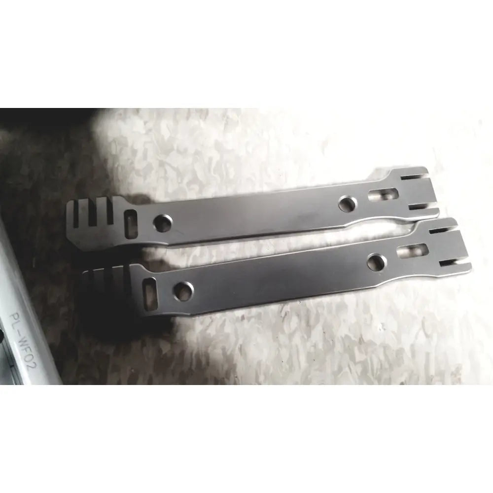 Two sleek metallic tool handles with matte finish and cutouts for acumed modular hand system missing piece