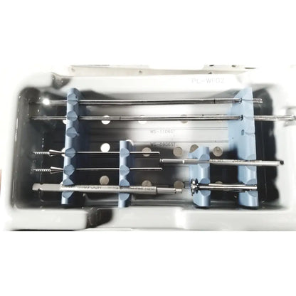 Medical-grade stainless steel spinal fixation screws and rods in a tray with spacers for acumed modular hand system set