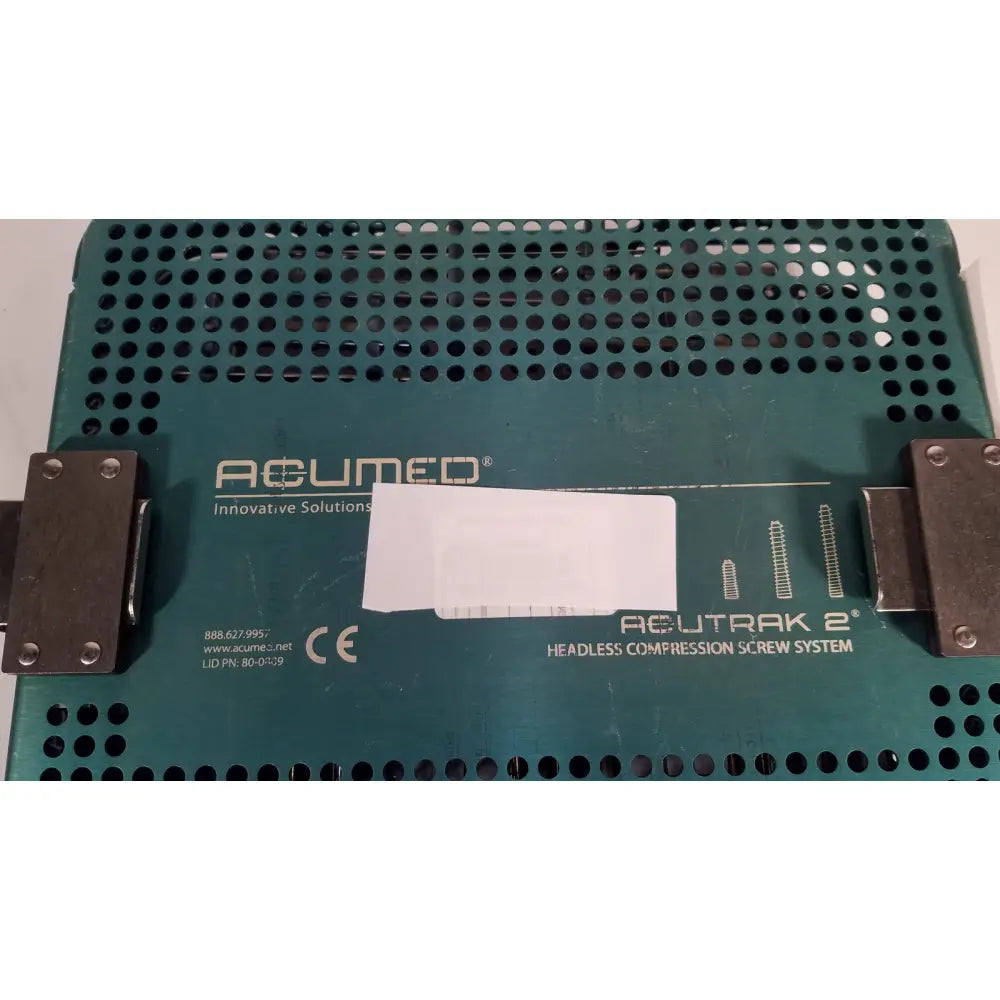 Green perforated metal tray labeled acumed acutrak 2 headless compression screw system for headless compression screw use