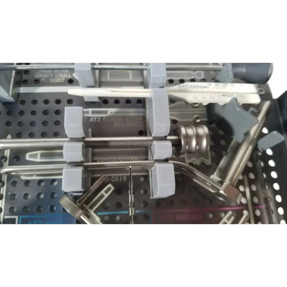 Silver surgical drill with gray plastic handle and engraved markings from acutrak 2 headless compression screw system
