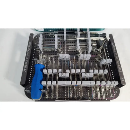 Blue-handled headless compression screw instruments in a black tray labeled acutrak 2 for reuse medical procedures