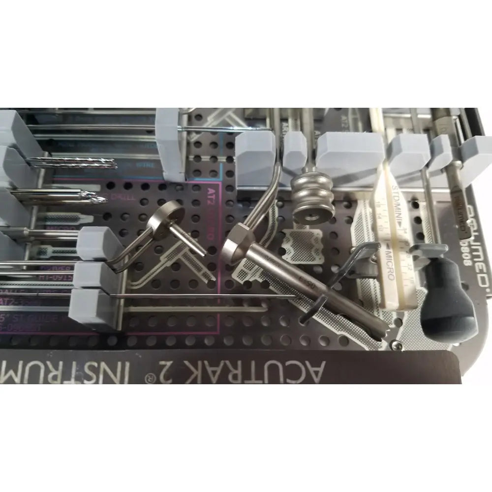Stainless steel surgical instruments with gray holders in perforated tray for acutrak 2 headless compression screw system reuse medical