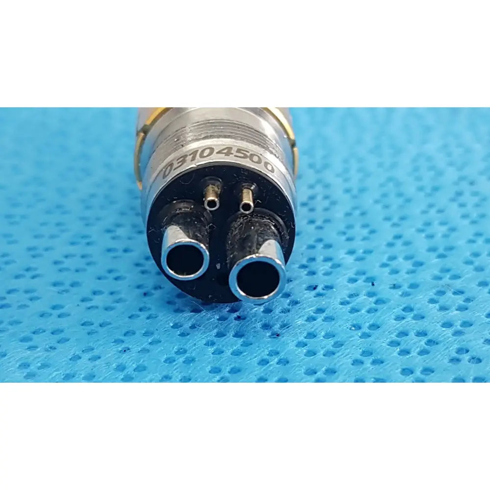 Silver and gold medical-grade adapter for w&h lw-style air high-speed handpieces model 03104500 showing front view