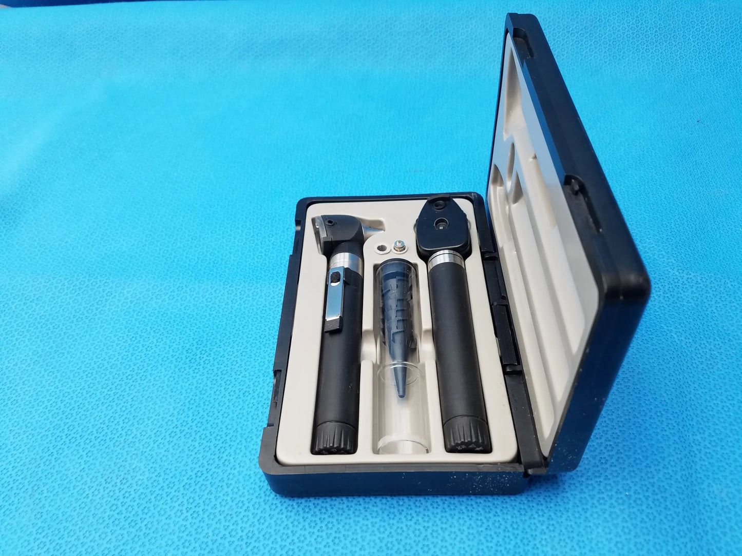 Black and silver ADC Diagnostix otoscope pocket diagnostic set in a black carrying case for medical use