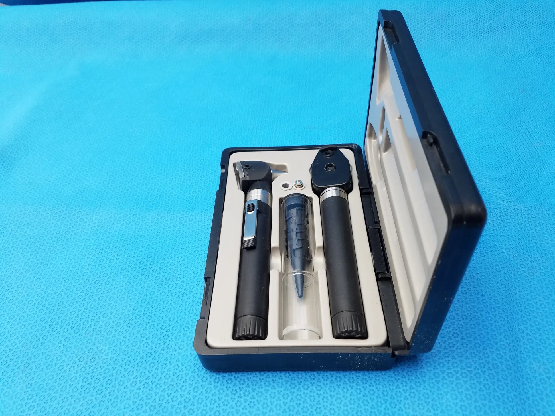 Black and silver ADC Diagnostix otoscope pocket diagnostic set in a black carrying case for medical use