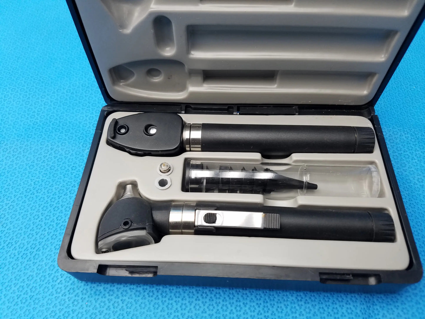 Black and silver adc diagnostix otoscope pocket diagnostic set in molded case for medical examination use