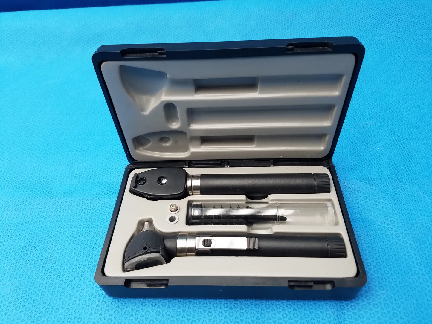 Black and silver ADC Diagnostix otoscope pocket diagnostic set in molded case for medical examination use