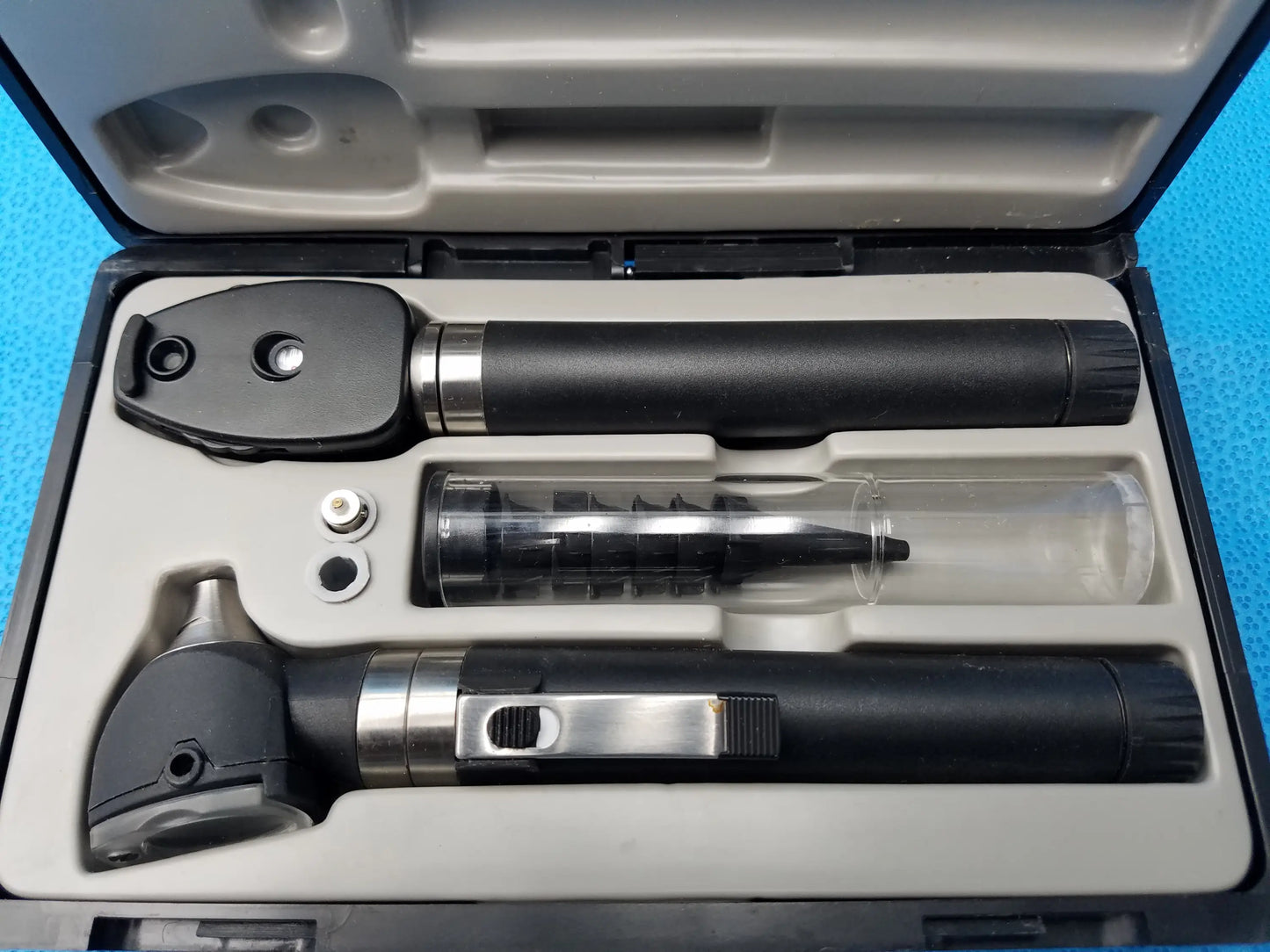 Black and silver otoscope with sleek ergonomic design in adc diagnostix pocket diagnostic set with case