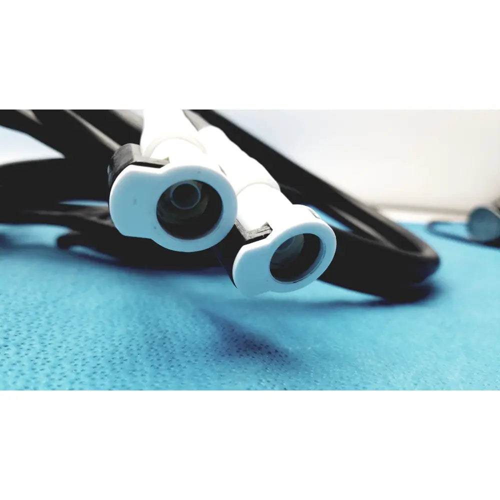 White plastic medical endoscope connectors with black cables on the back side of adroit htp-1500 heat therapy pump