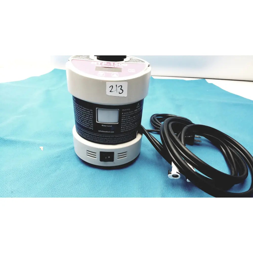 Gray and white medical-grade adroit htp-1500 heat therapy pump with digital display and black power cord labeled 213