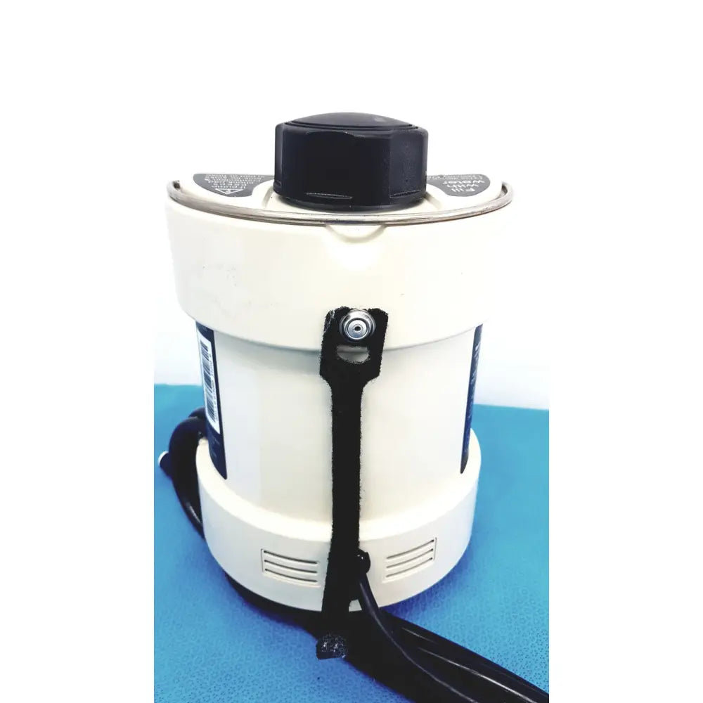 White cylindrical electric can opener with black handle and ventilation slots shown with adroit htp-1500 heat therapy pump portable hot cold unit