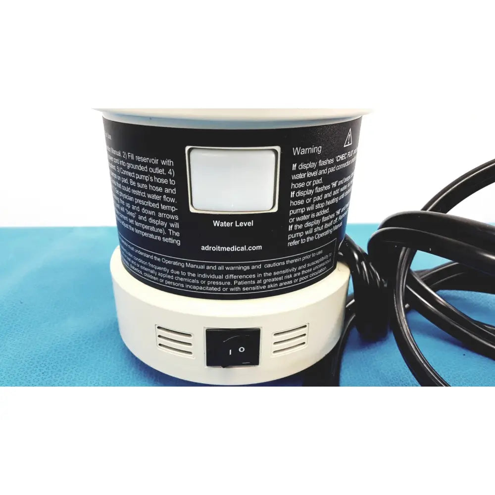 White cylindrical heat therapy pump with black label and water level indicator for portable hot cold therapy use
