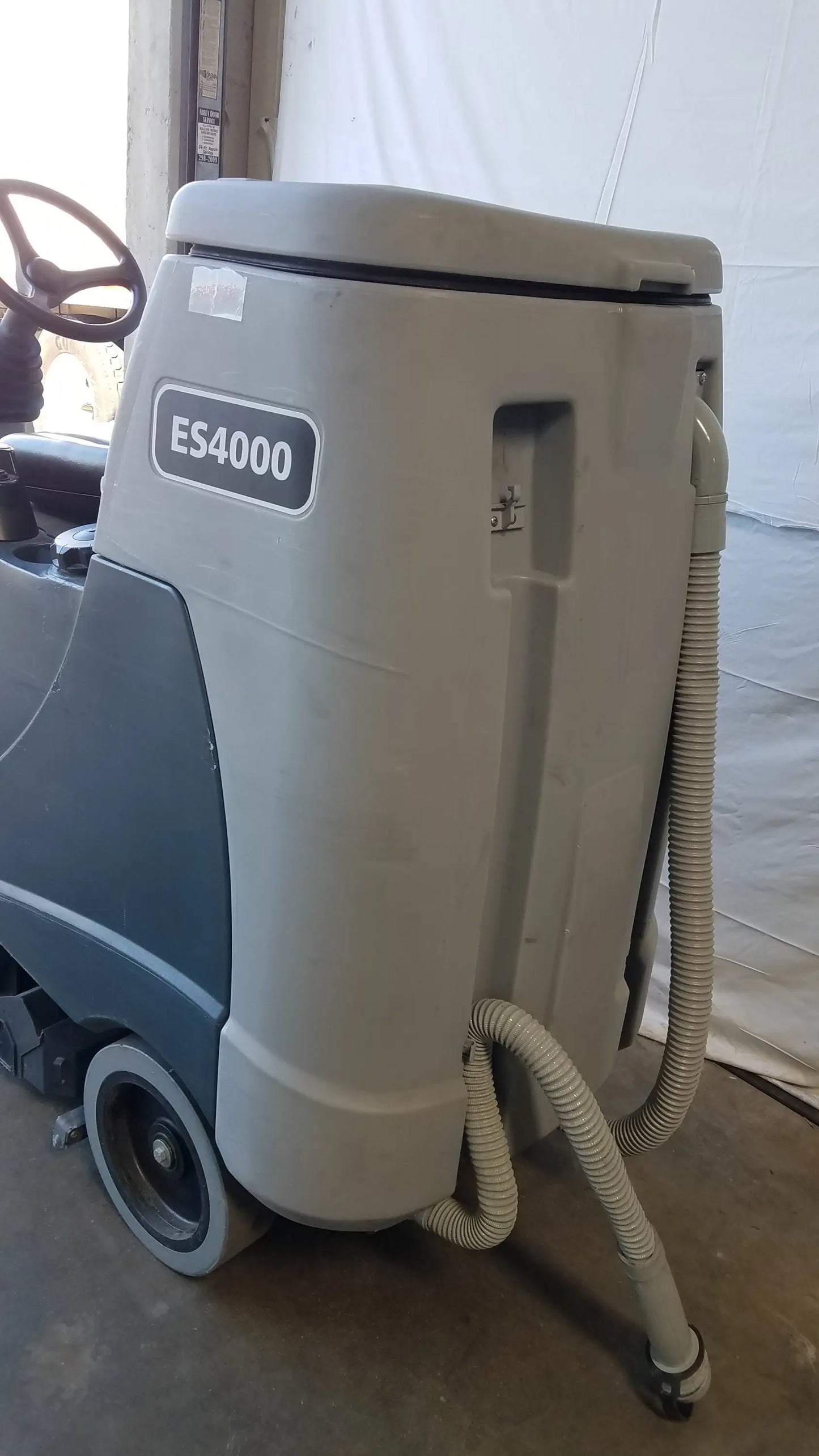 Gray and dark gray advance es4000 ride on carpet cleaner extractor with visible model label for wet dry vacuum use