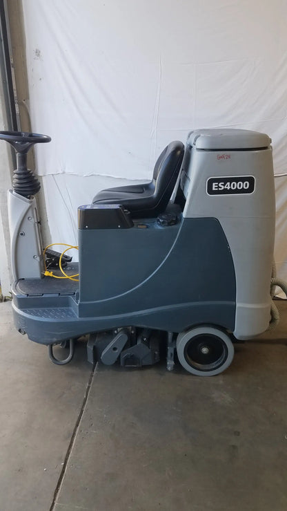 Gray and black Advance ES4000 ride on carpet cleaner extractor with steering wheel for wet dry vacuum cleaning