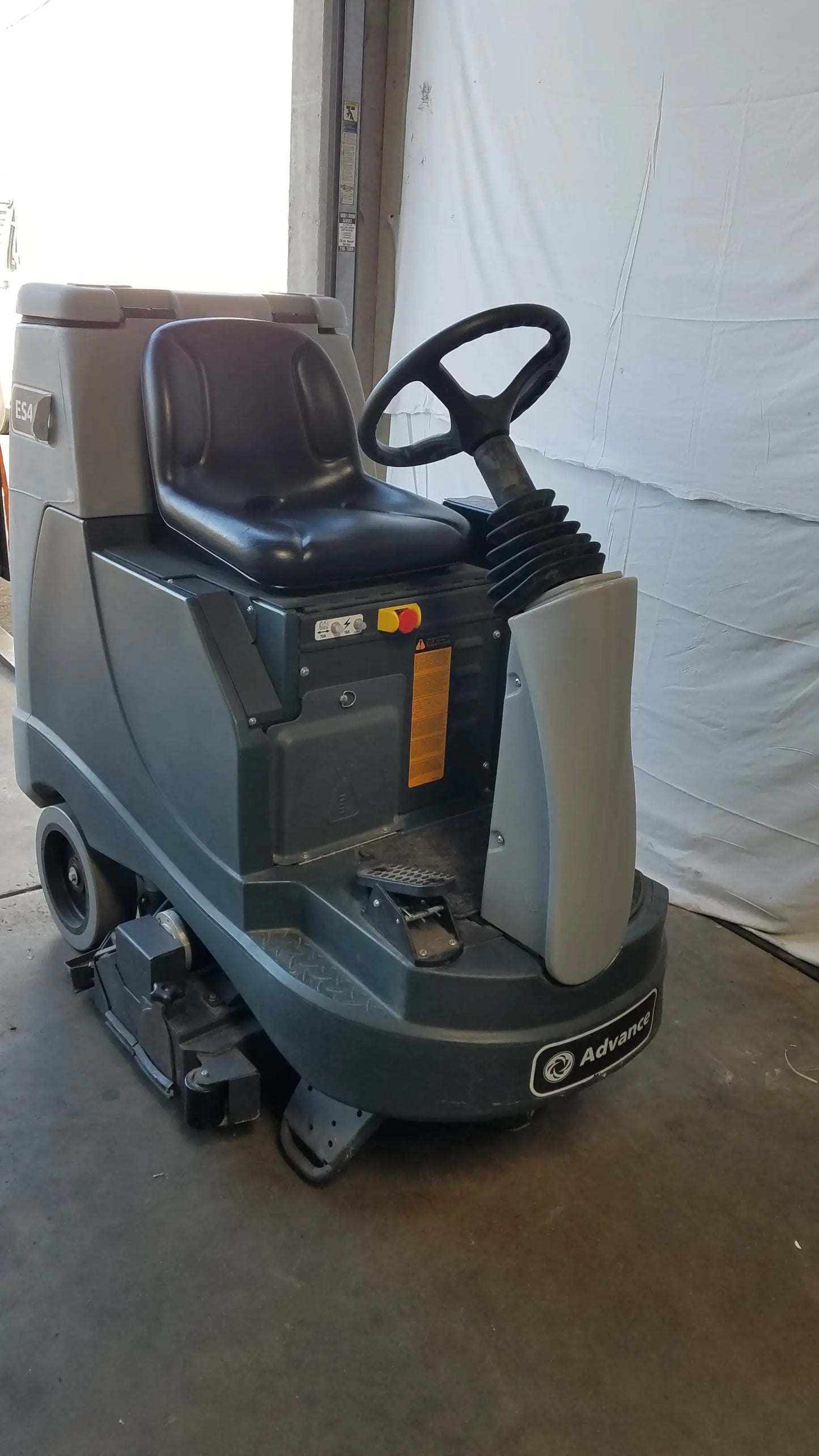 Gray and black advance es4000 ride on carpet cleaner extractor with steering wheel for wet dry vacuum cleaning