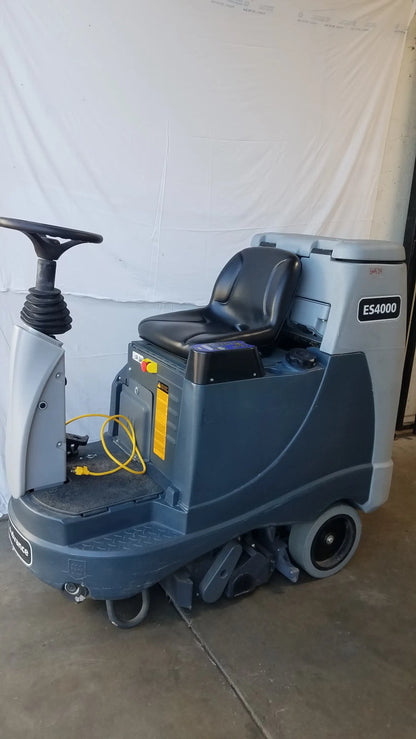 Gray and black industrial advance es4000 ride on carpet cleaner extractor with steering wheel for wet dry cleaning