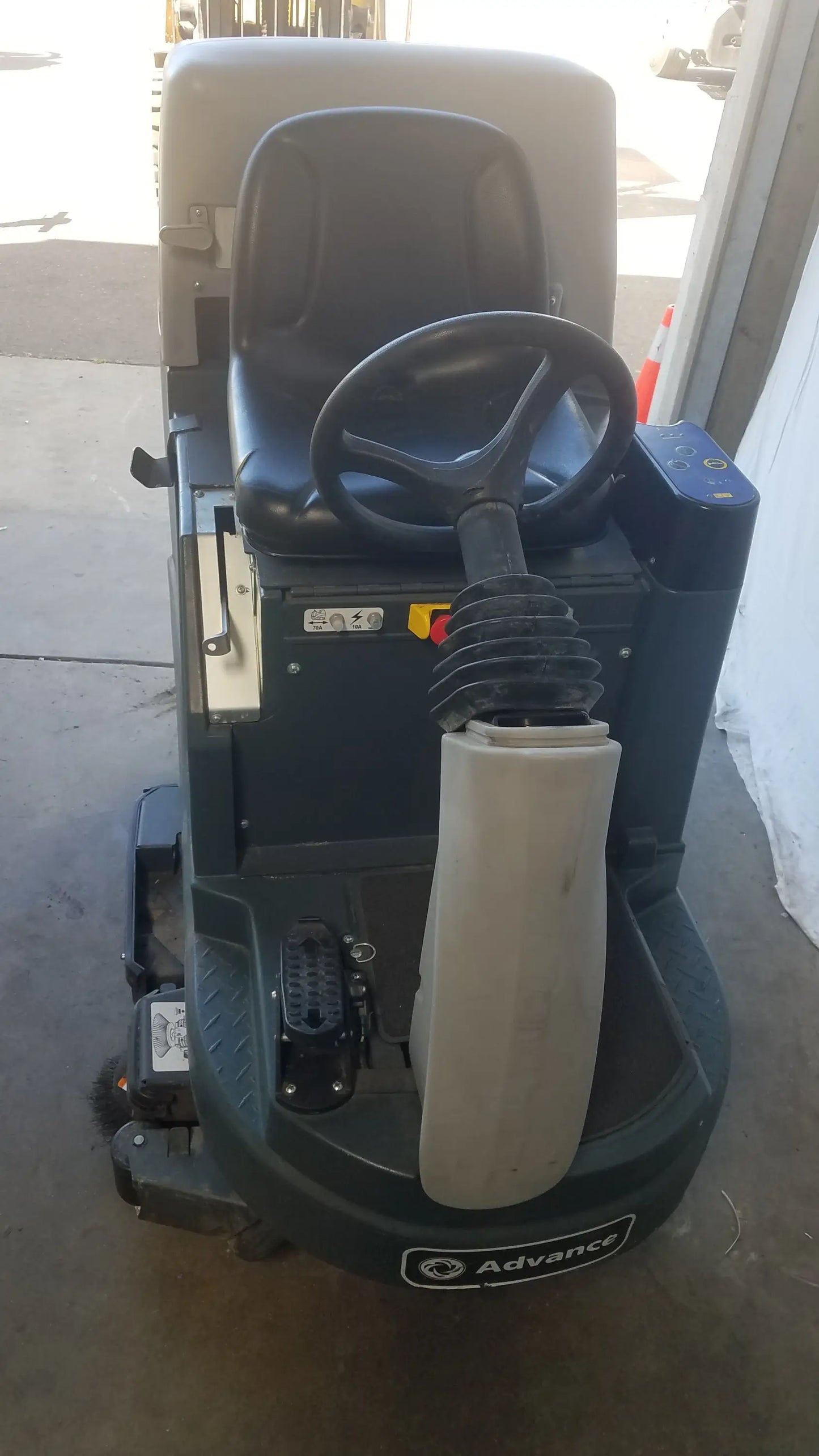 Black and gray advance ride on carpet cleaner extractor with padded seat steering wheel and cleaning attachment