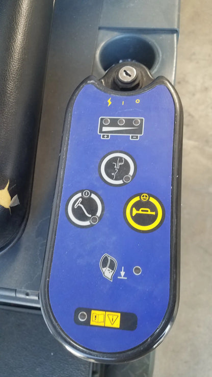 Blue control panel with black trim and yellow warning symbols featuring keyhole on advance ride on carpet cleaner extractor
