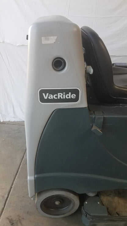 Gray and dark green Advance ride on carpet cleaner extractor with black seat for commercial wet dry cleaning use