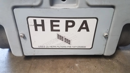 Gray plastic housing with white label reading hepa indicating two hepa filters on advance ride on carpet cleaner extractor