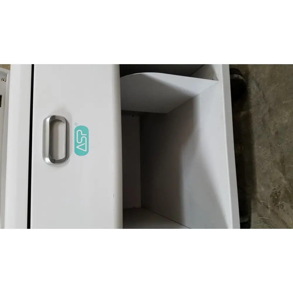 White plastic cabinet with silver metal handle and teal logo sticker on advanced sterilization products sterrad nx sterilizer