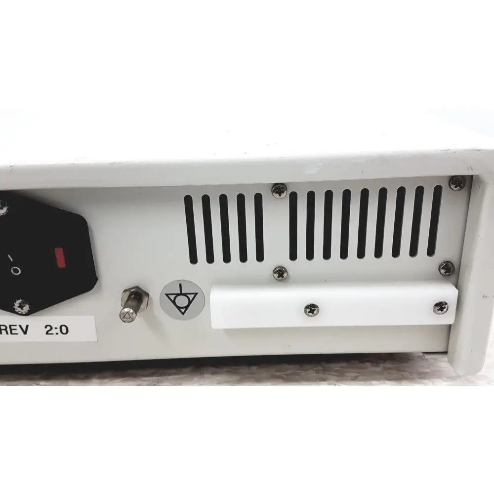 White rectangular aesculap 78532 lektrofuse electrosurgical generator unit with black ventilation slats and power switch