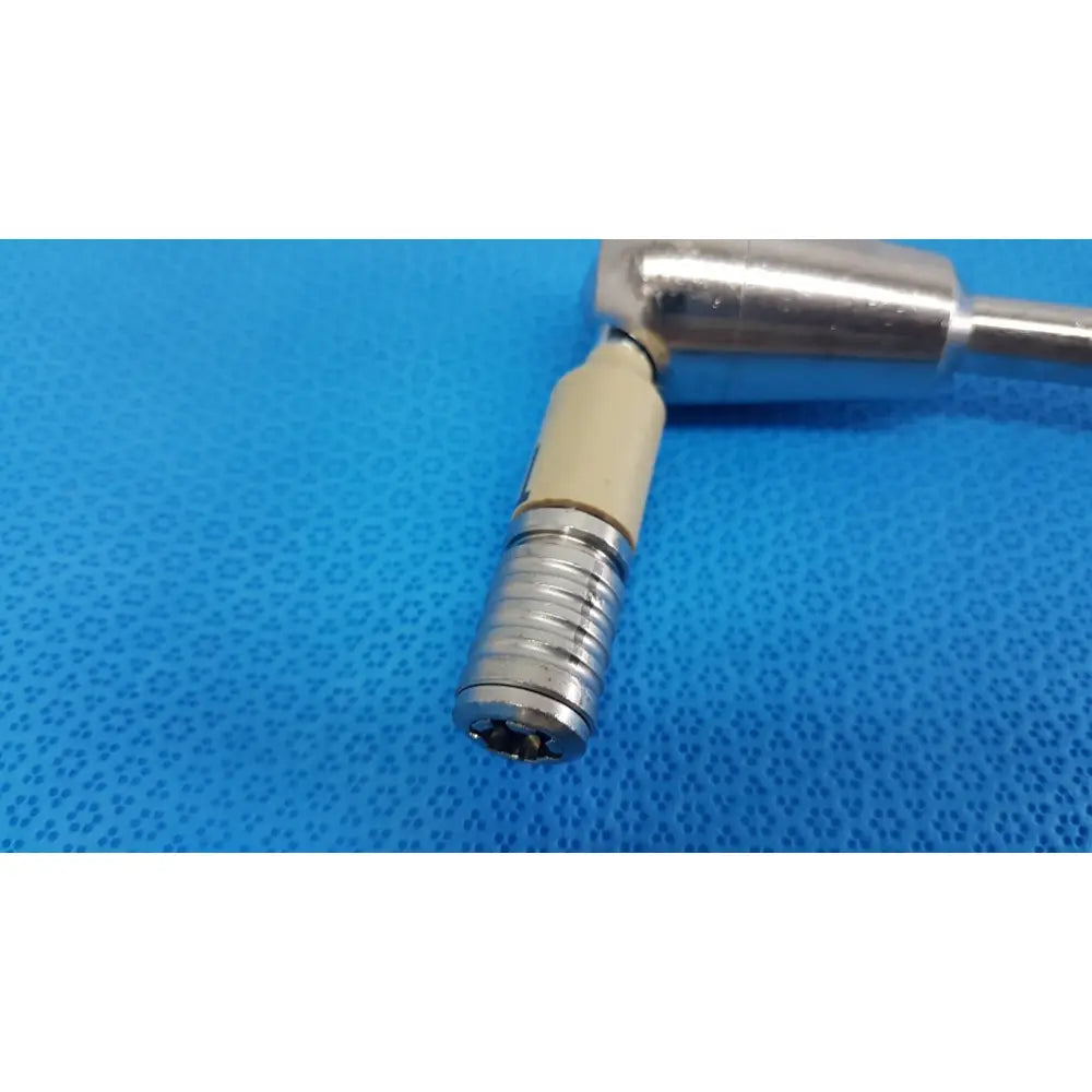 Silver surgical drill bit with beige plastic handle and threaded shaft part of aesculap ff168r surgical retractor system