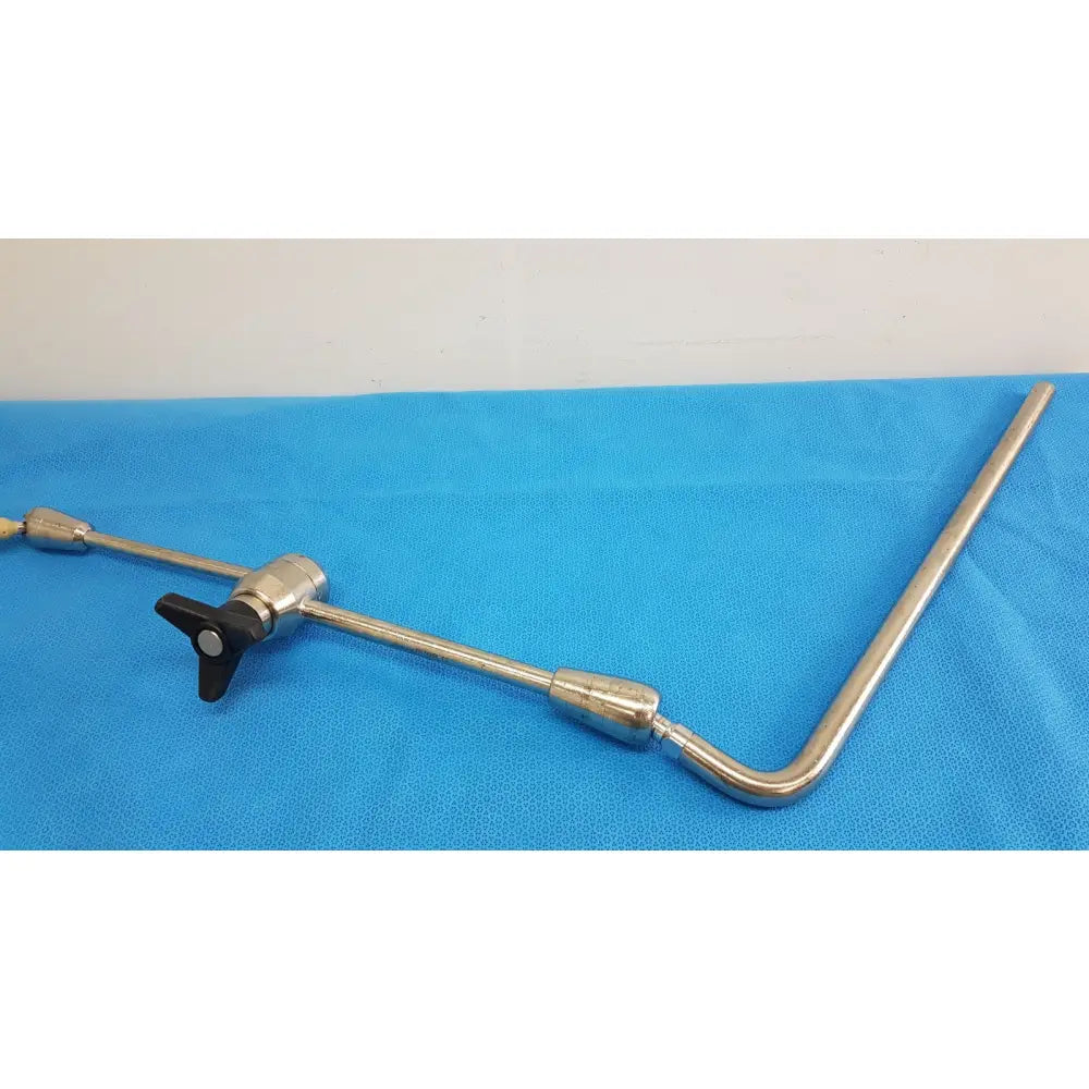 Silver metal surgical retractor with black plastic handle of aesculap ff168r u-shaped arm surgical retractor system component