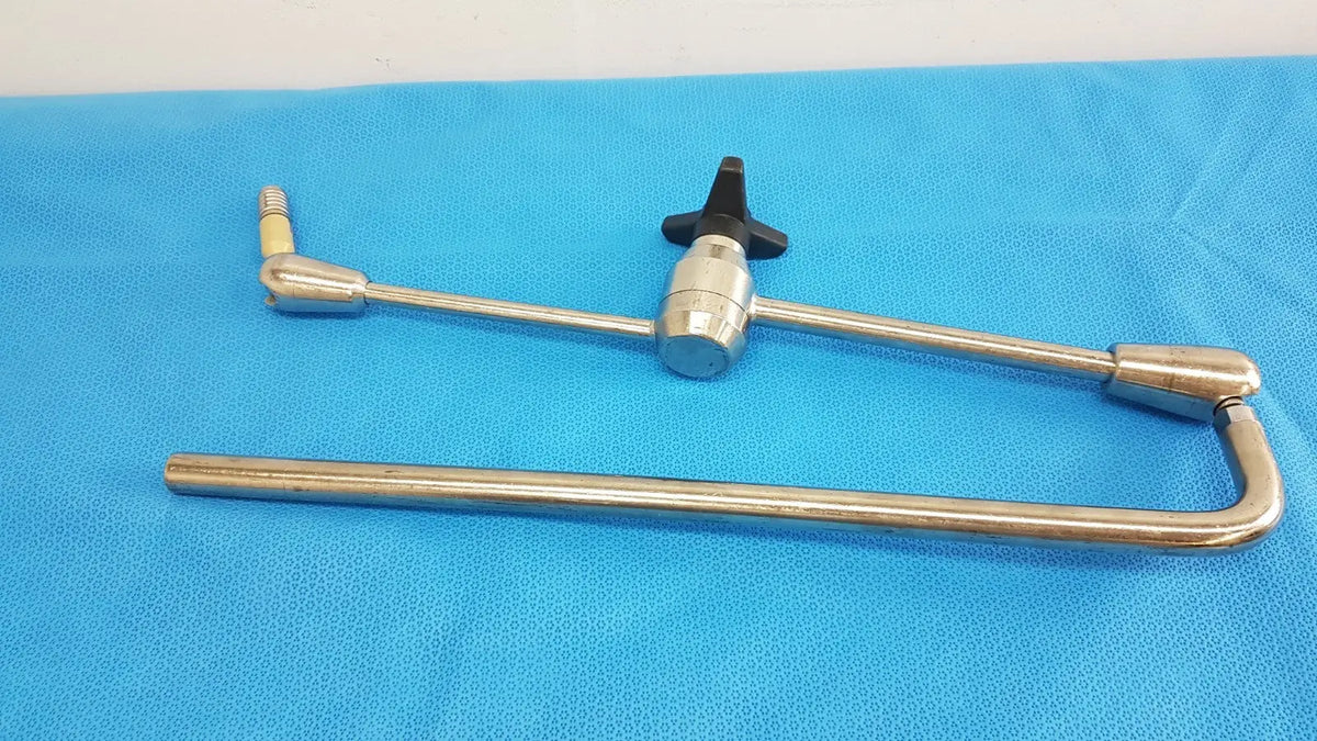 Stainless steel aesculap ff168r surgical retractor with black knob handle and articulated joint component