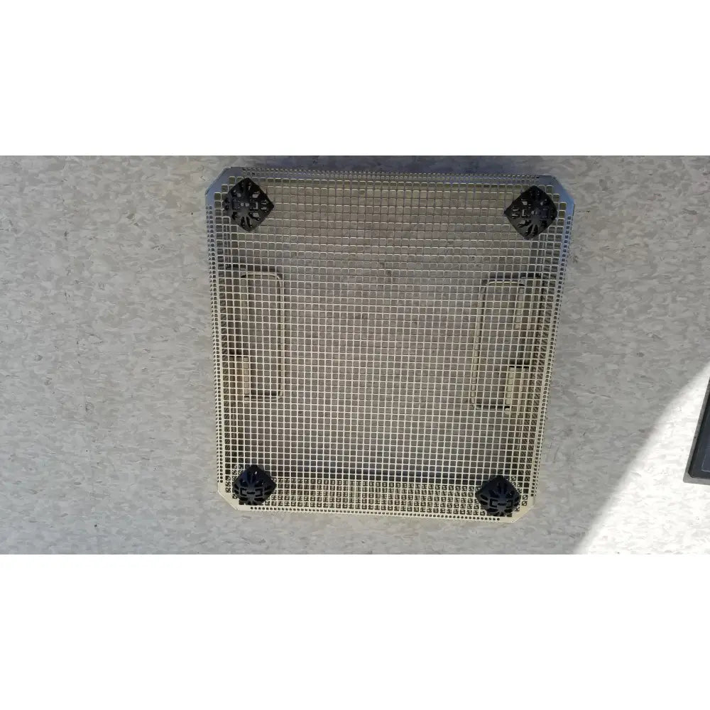 Square metal mesh grate with black plastic corner caps of aesculap jf113r stainless steel instrument sterilization basket tray