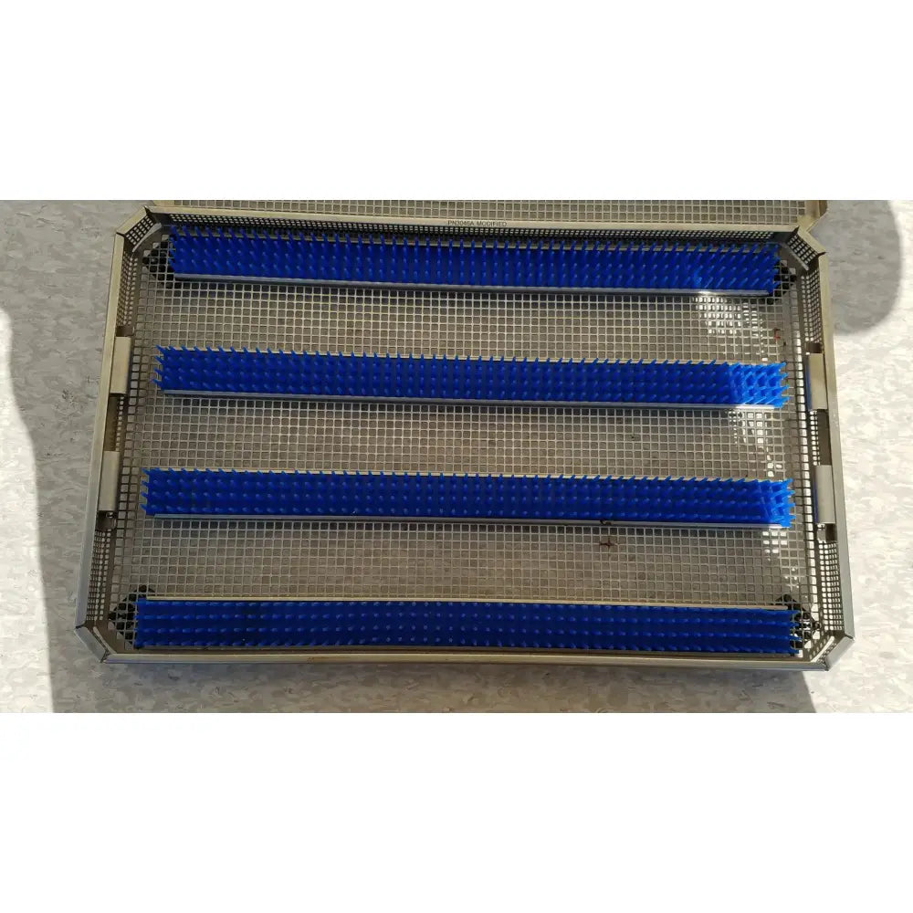 Blue plastic bristle trays arranged in a metal mesh tray for aesculap jf257r jf251r sterilization case pn3046a modified