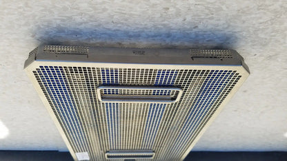 Silver metallic mesh air vent with rectangular handle and perforated grille on aesculap jf257r sterilization case tray