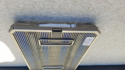 Silver-colored metal mesh air vent with rectangular grille and two handles on aesculap jf257r sterilization case tray pn2089a