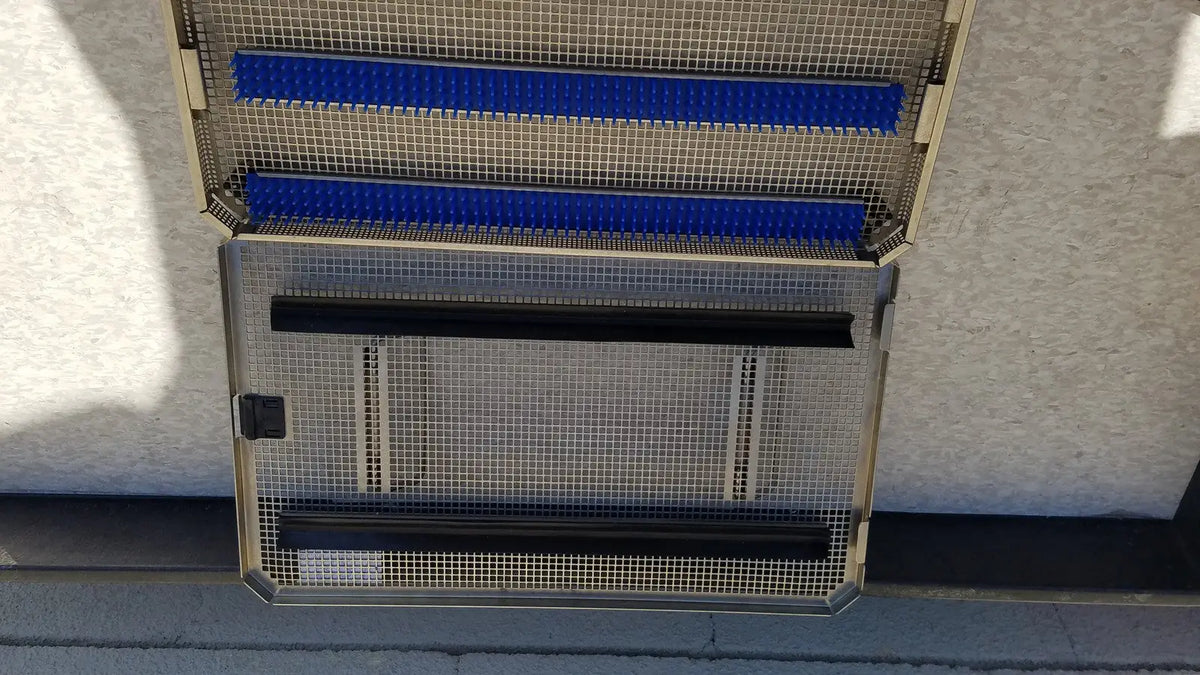 Metal mesh storage rack with blue and black bars in aesculap jf257r sterilization case tray pn2089a modified model