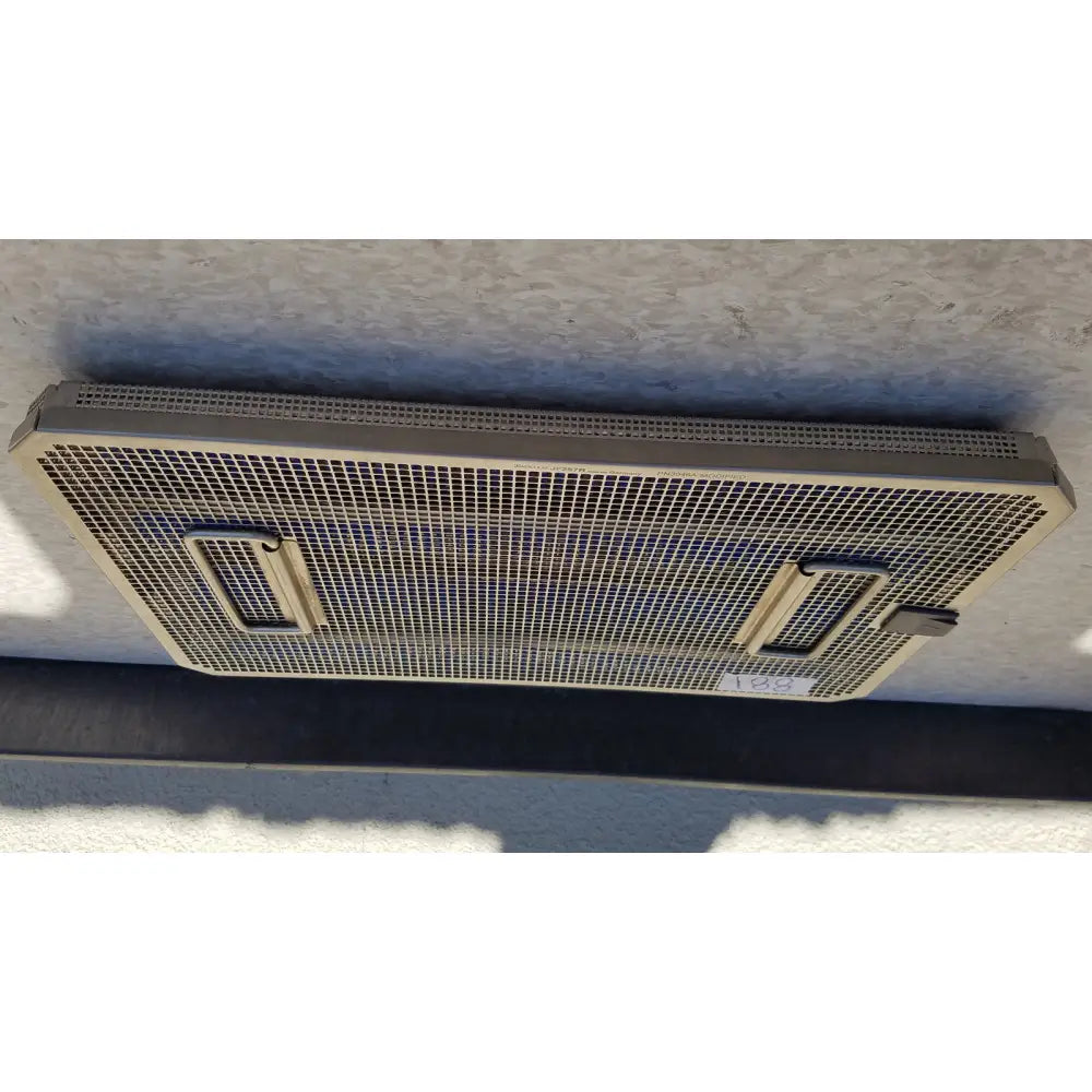 Metal mesh ventilation grille with two rectangular handles on the sides on the back of aesculap jf257r sterilization case tray pn2089a modified