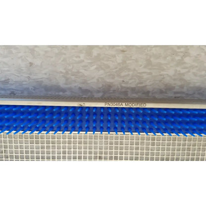 Blue plastic comb-like component with white metallic frame marked pn3046a modified for aesculap jf257r sterilization case tray