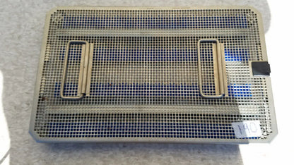 Rectangular metal mesh aesculap jf257r sterilization case tray with two side handles and black latch on one corner