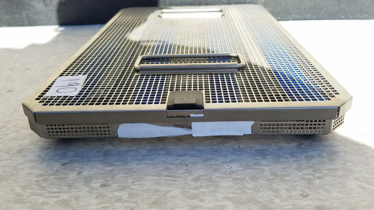 Tan metal mesh aesculap jf257r sterilization case tray with handle and latch for surgical instrument sterilization