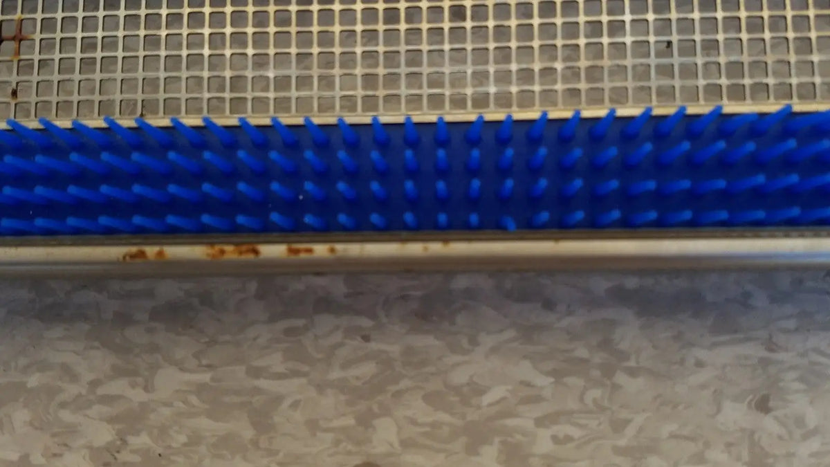 Blue plastic bristle brush with metallic base for aesculap jf257r sterilization case tray pn3046a modified
