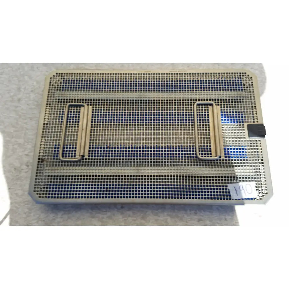 Rectangular metal mesh aesculap jf257r sterilization case tray with two side handles and black latch on one corner