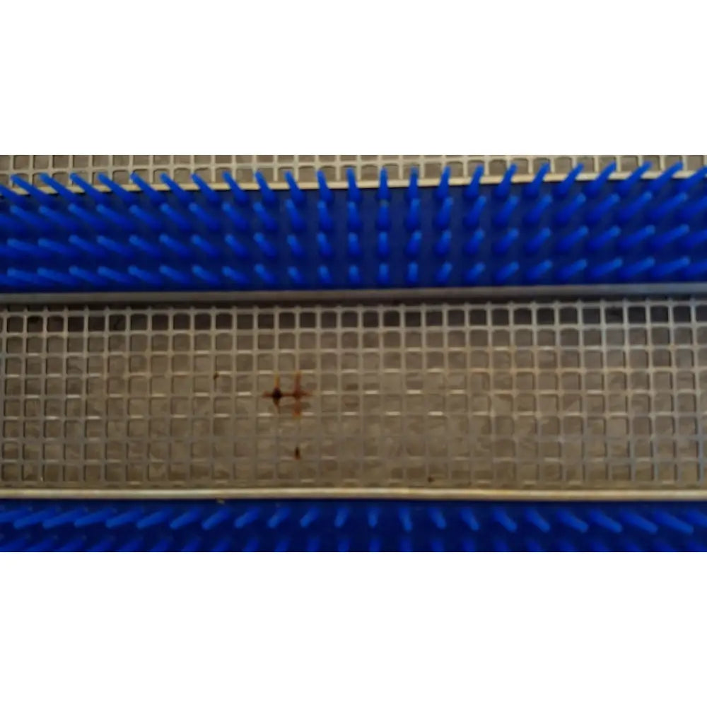Blue plastic bristle brush with metal grid base in aesculap jf257r sterilization case tray pn3046a modified model