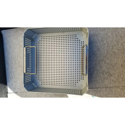 Silver perforated metal grill basket with two side handles for aesculap jk341 half size sterilization case and lid