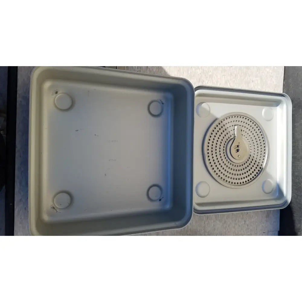Gray plastic aesculap jk341 half size sterilization case with matching perforated insert and central handle