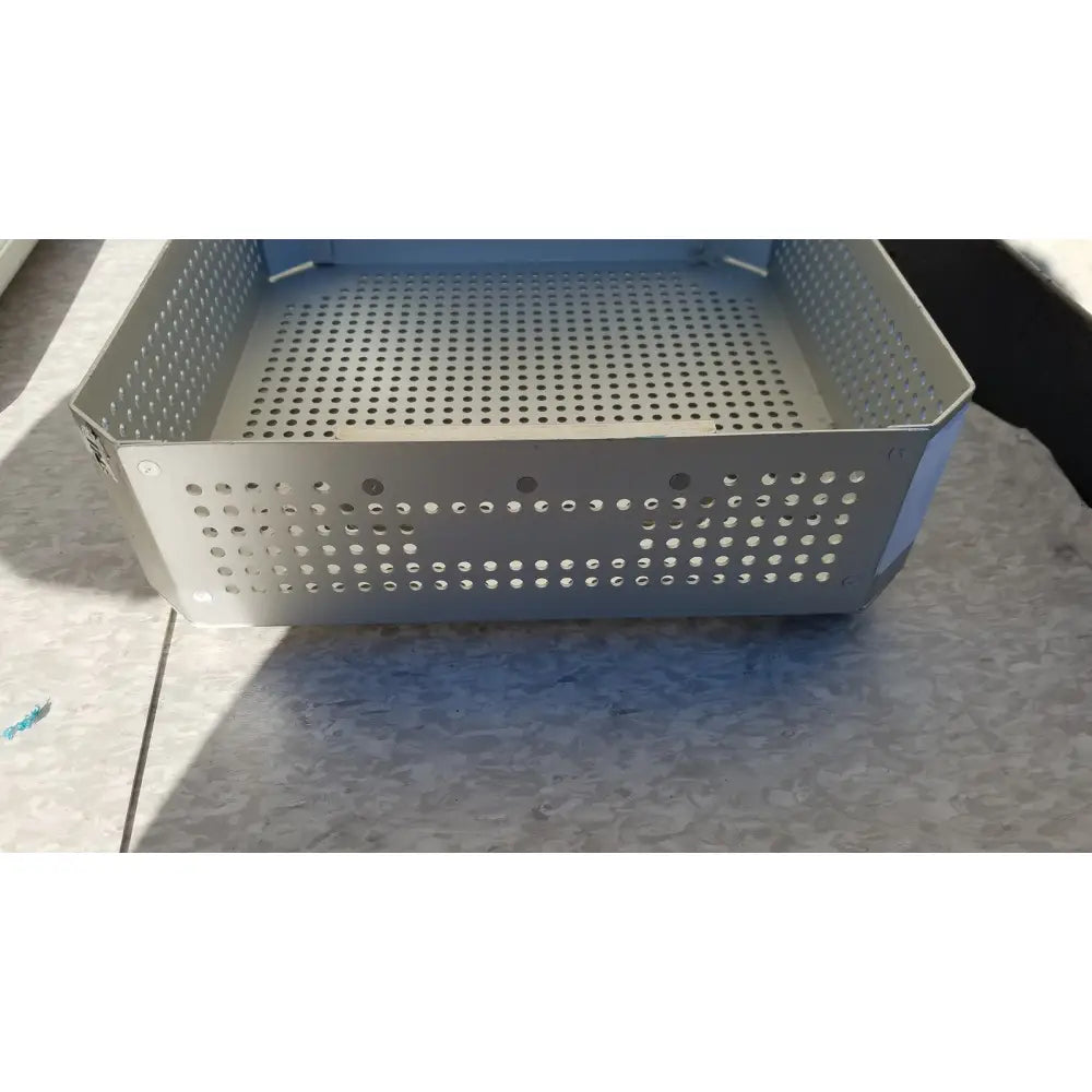Silver perforated metal storage basket with hexagonal shape and circular holes for aesculap jk341 half size sterilization case