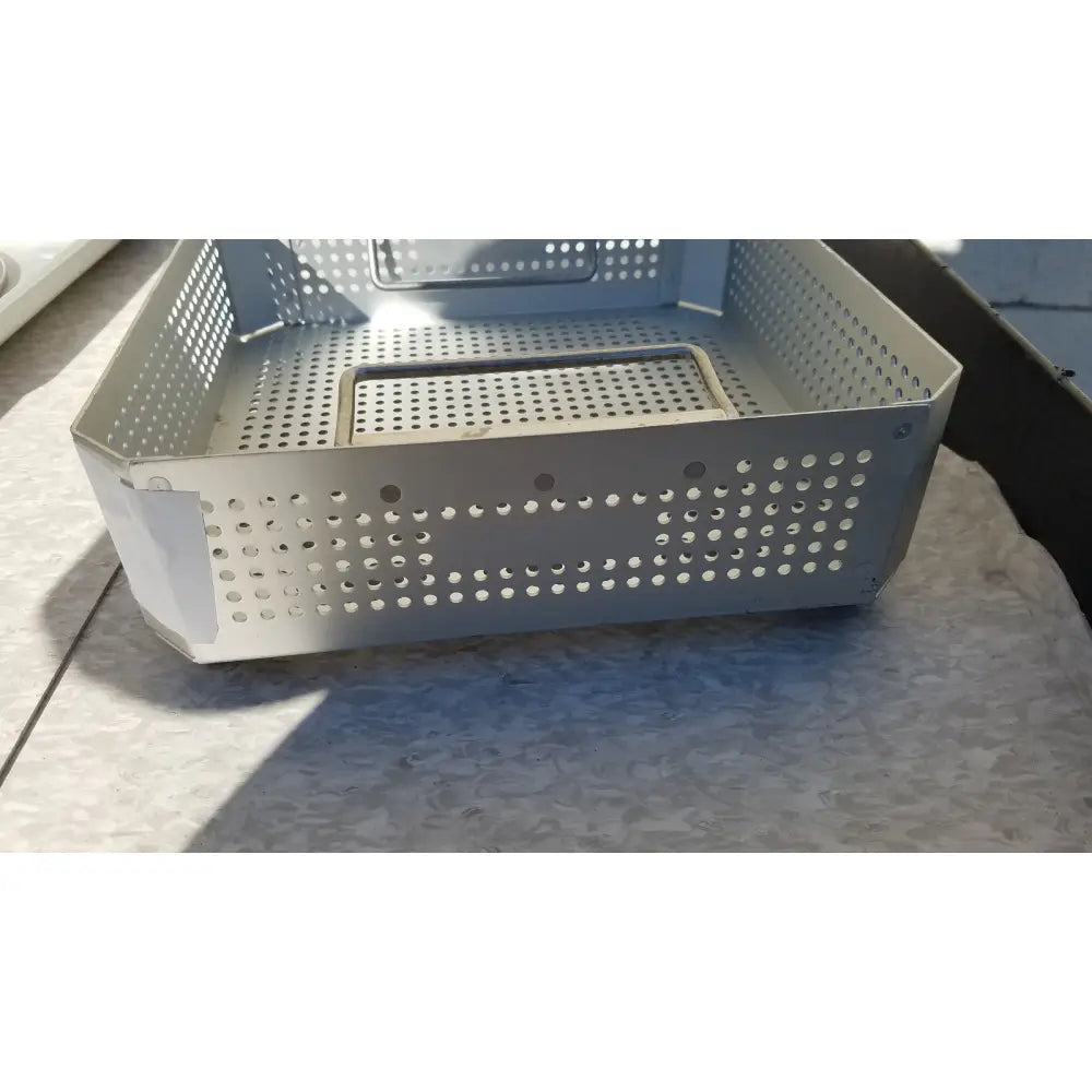 Silver perforated metal storage basket with reinforced corners for aesculap jk341 half size sterilization case and lid