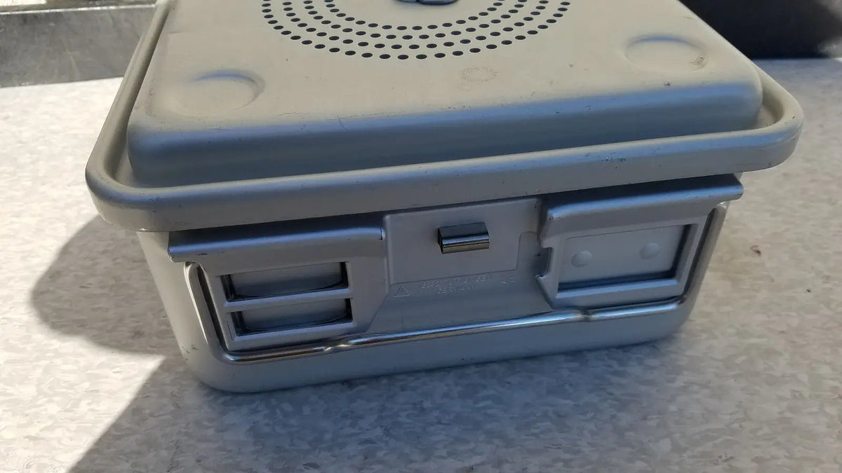 Gray plastic aesculap jk341 half size sterilization case with perforated lid and secure latches