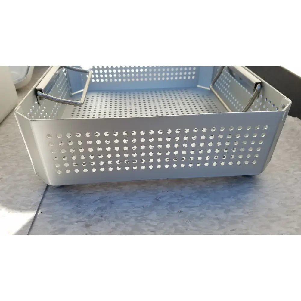 Silver perforated metal aesculap jk341 half size sterilization pan with reinforced handles and lid