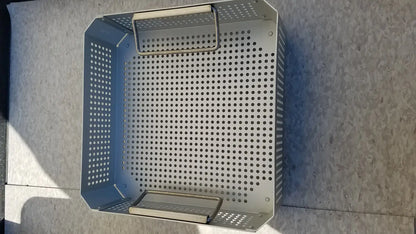 Silver perforated metal grill basket with handle and base tray in aesculap jk341 half size sterilization case