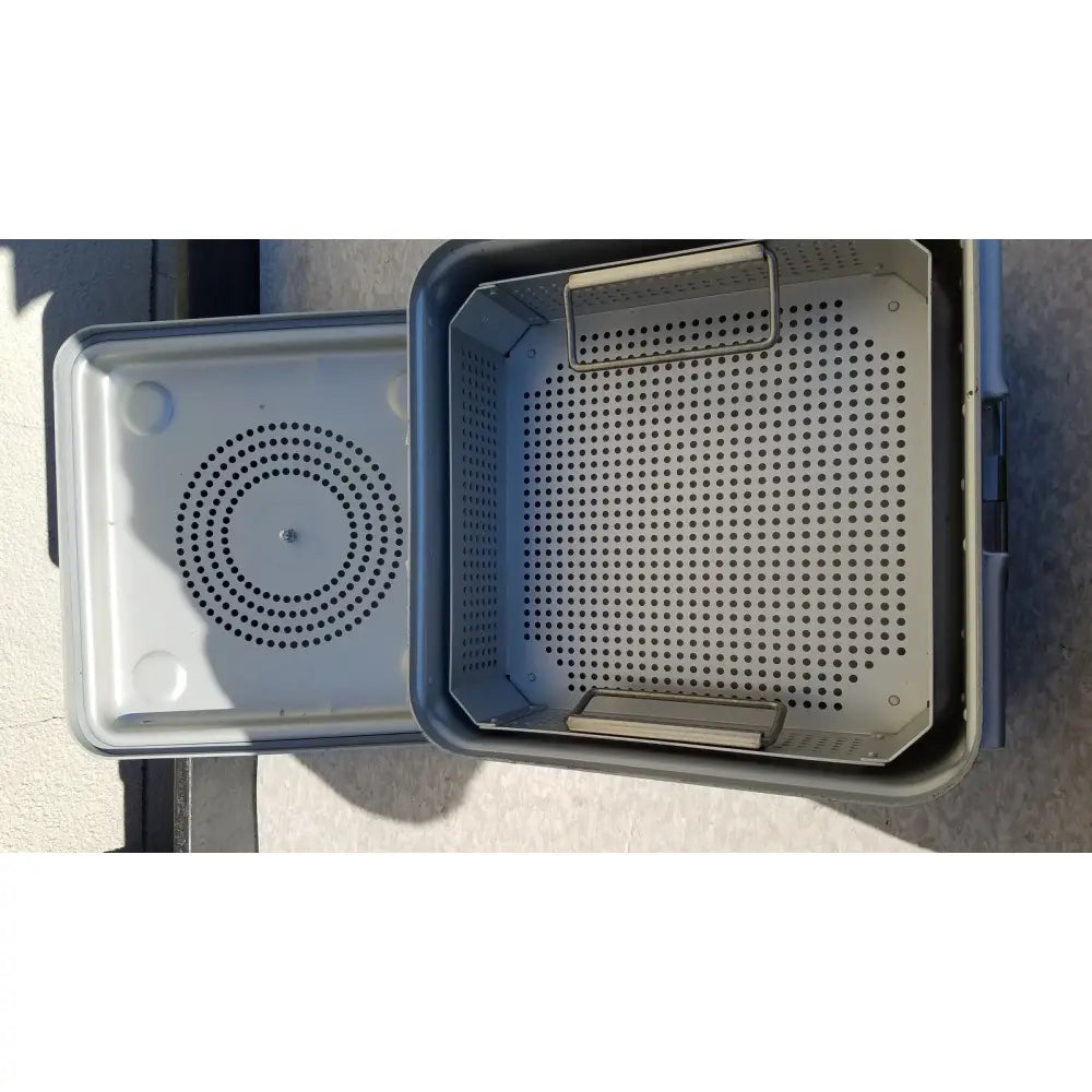 Gray plastic aesculap jk341 half size sterilization case with perforated metal insert for efficient sterilization