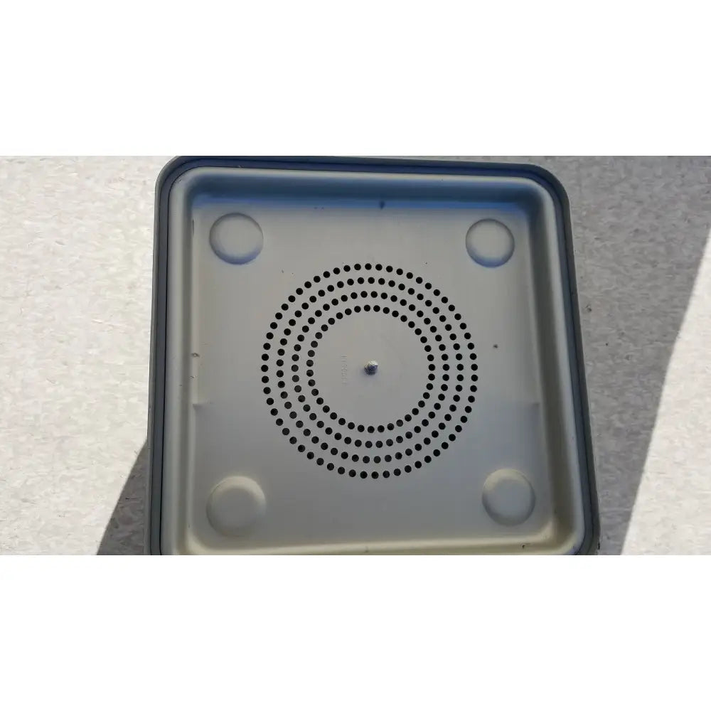 Gray plastic aesculap jk341 half size sterilization case with lid features black perforated speaker pattern and rounded feet